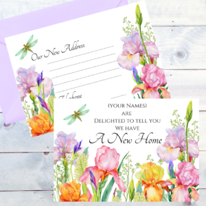 Picture shows front and back of Iris Garden postcard style new home cards in our Iris Garden design and with a coloured envelope on whitewashed timber boards